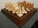 Chess set with a brown ash board decorated with leaf carvings and chess pieces "Game of Thrones"