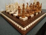 Chess set: ash chess board in brown with leaf carving on the top and chess pieces "Game of Thrones"