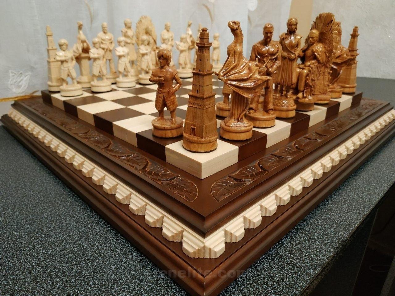 il_fullxfull.1848201072_e7ne.jpg Chess set: ash chess board in brown with leaf carving on the top and chess pieces "Game of Thrones"