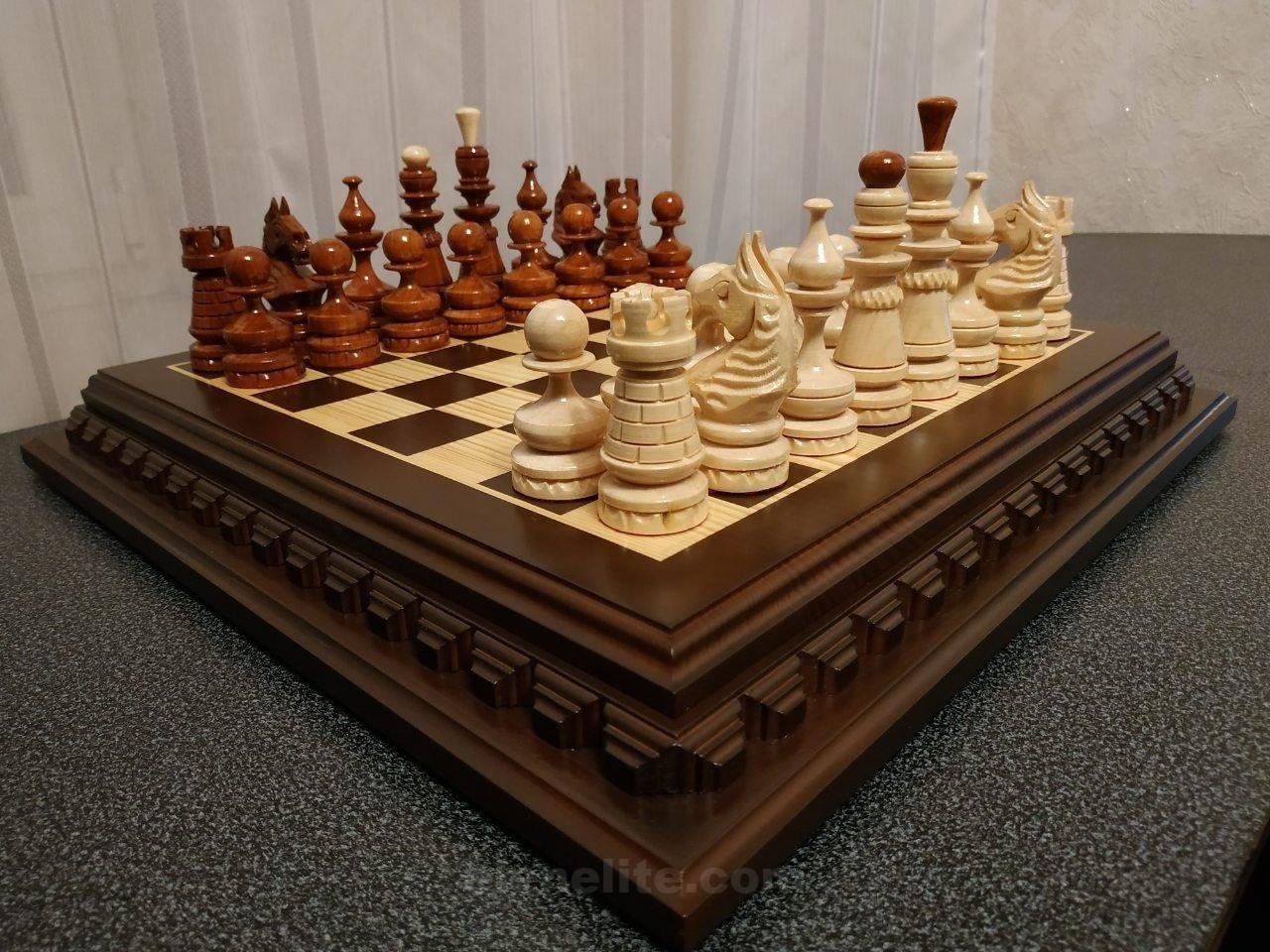 il_fullxfull.2083856264_g9tm.jpg Traditional chess set with carved wooden board and figures