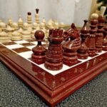 Elegant handmade chess set in rare cherry brown color with gold accents and super glossy finish