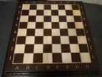 Engraving letters and numbers on a chessboard. - Image 2