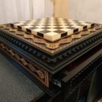 the chess board is equipped with 2 drawers for storing chess pieces and is inlaid with a beads
