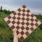 classic chess board features natural tones and a versatile design without excessive decoration