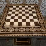 An elegant ash chess board with contrasting carvings and bead inlay - handcrafted with a distinctive wood grain