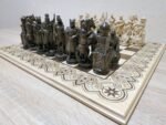 Premium carved chess pieces on handmade wooden board