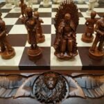 Vintage wooden chess board with handmade chess pieces