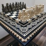 handmade chess set: ash board in black with elegant light carving and bead inlay