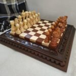 Chess set with brown ash board and maple pieces