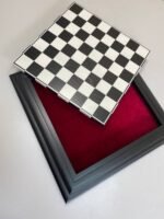 A wooden chess board with a removable game board and storage space for the pieces