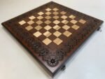 Folding chess board with velvet storage for pieces