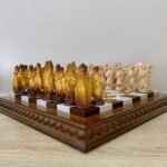 chess set: board in brown ombre with mirror shine and elegant chess pieces knights