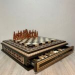 chess set with a board decorated with light carvings and decorative beads and pieces Game of Thrones