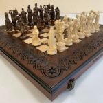 Wooden folding chess set with storage and handcrafted pieces