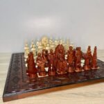 Chess set: Carved wooden chess board with Game of Thrones pieces