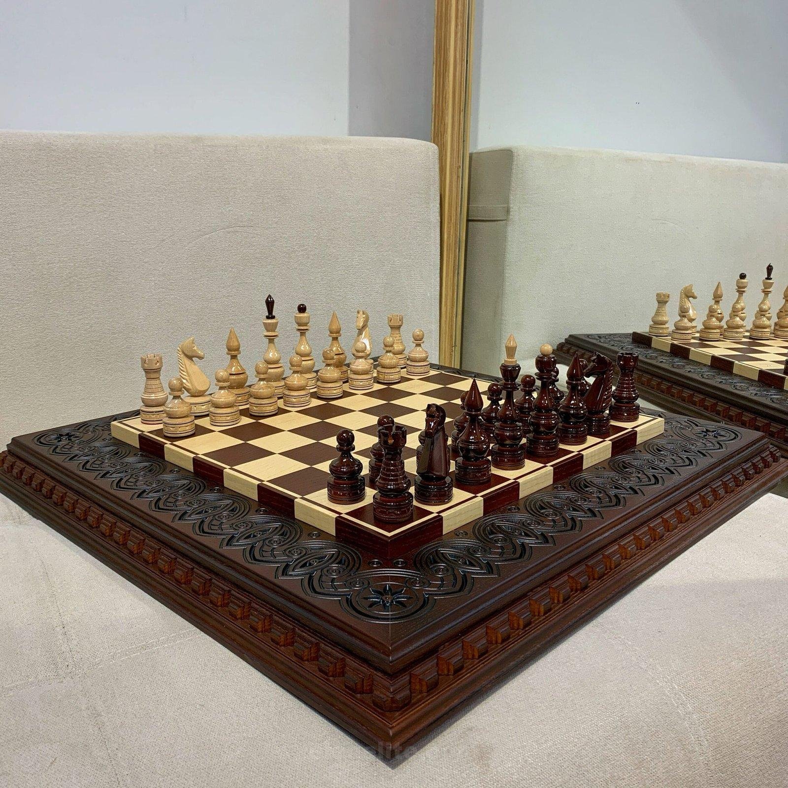 il_fullxfull.5794244204_s5vd-scaled-1.jpg A classic chess set featuring a dark brown ash board decorated with finely carved patterns