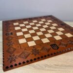 Handcrafted ash chess board with exquisite carvings: Trident and star of life