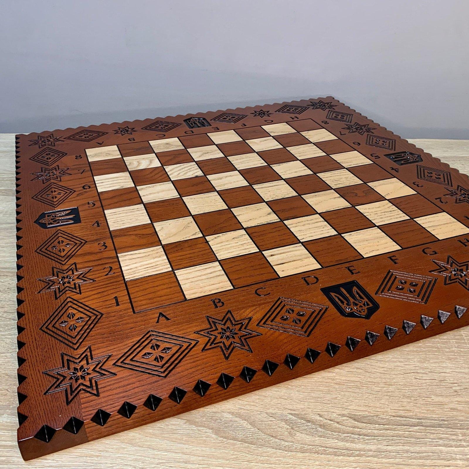 il_fullxfull.5803229279_qyx1-1-scaled-1.jpg Handcrafted ash chess board with exquisite carvings: Trident and star of life