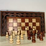 Chess set: Elegant folding chess board with wooden carved figures