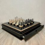 Classic chess set in black and beige tones with two velvet-lined drawers