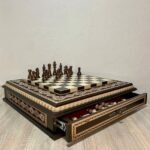 chess set: board with carvings and bead inlay and two drawers. 32 classic chess pieces
