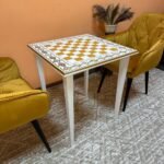 A unique white and gold carved ash chess table in a classic style